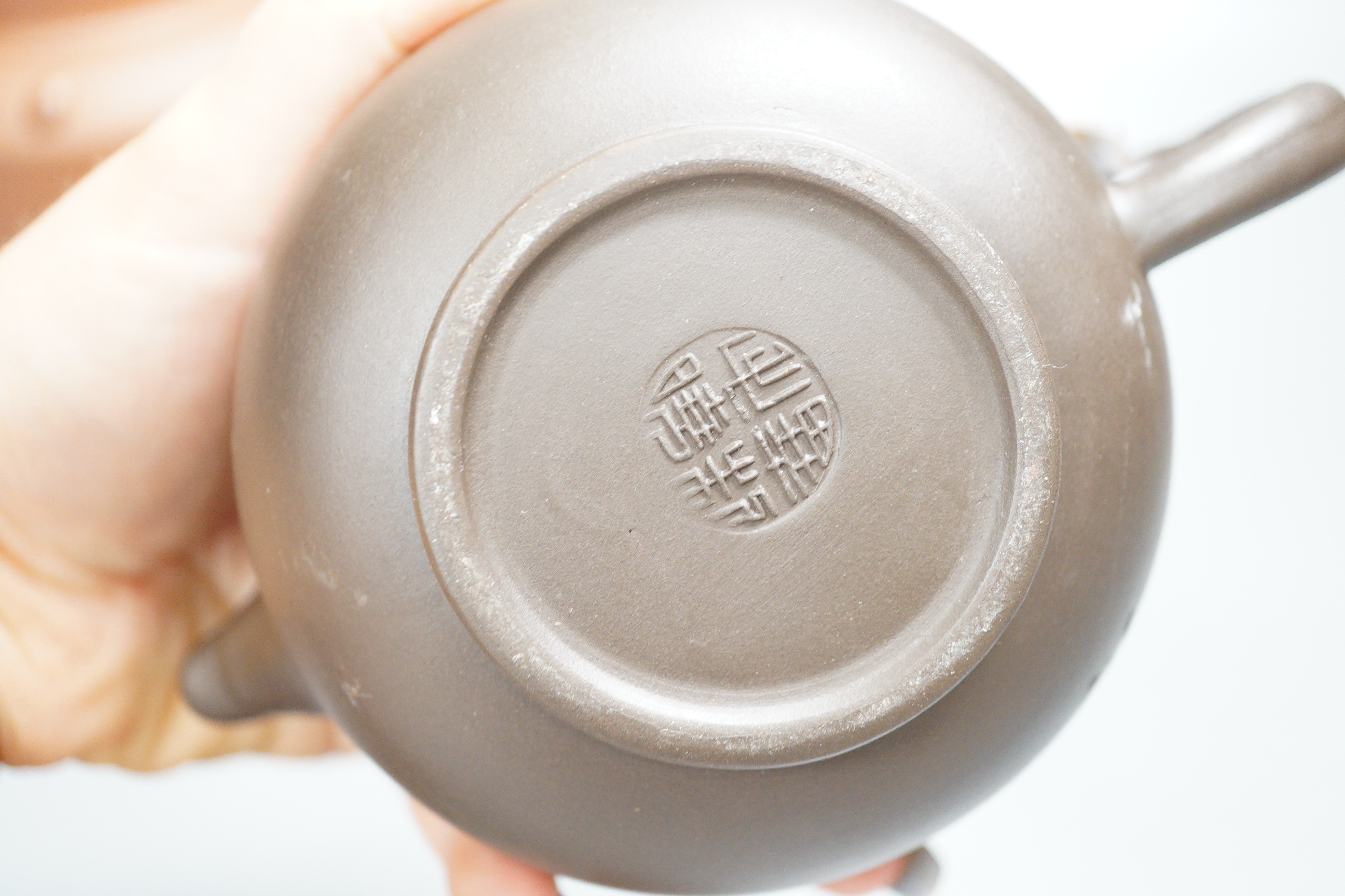 Two Chinese Yixing teapots and two similar teabowls. Tallest 14cm